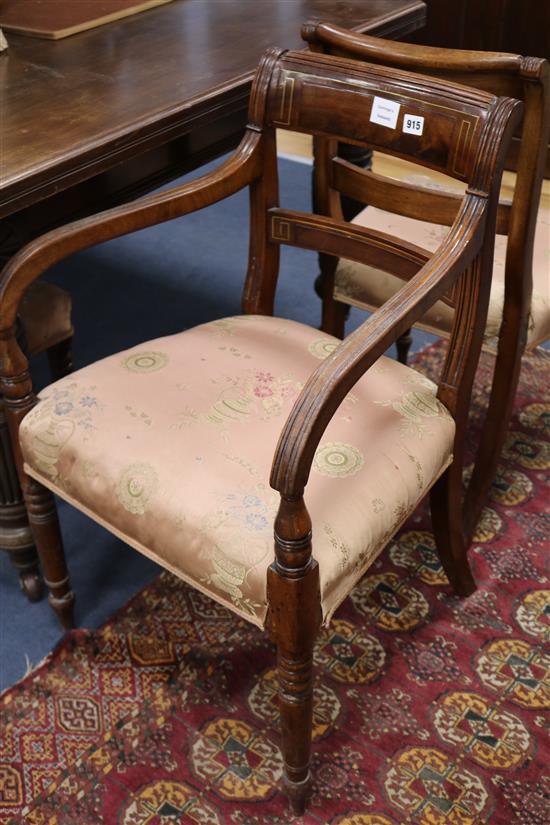 A set of seven Regency brass inset mahogany dining chairs	